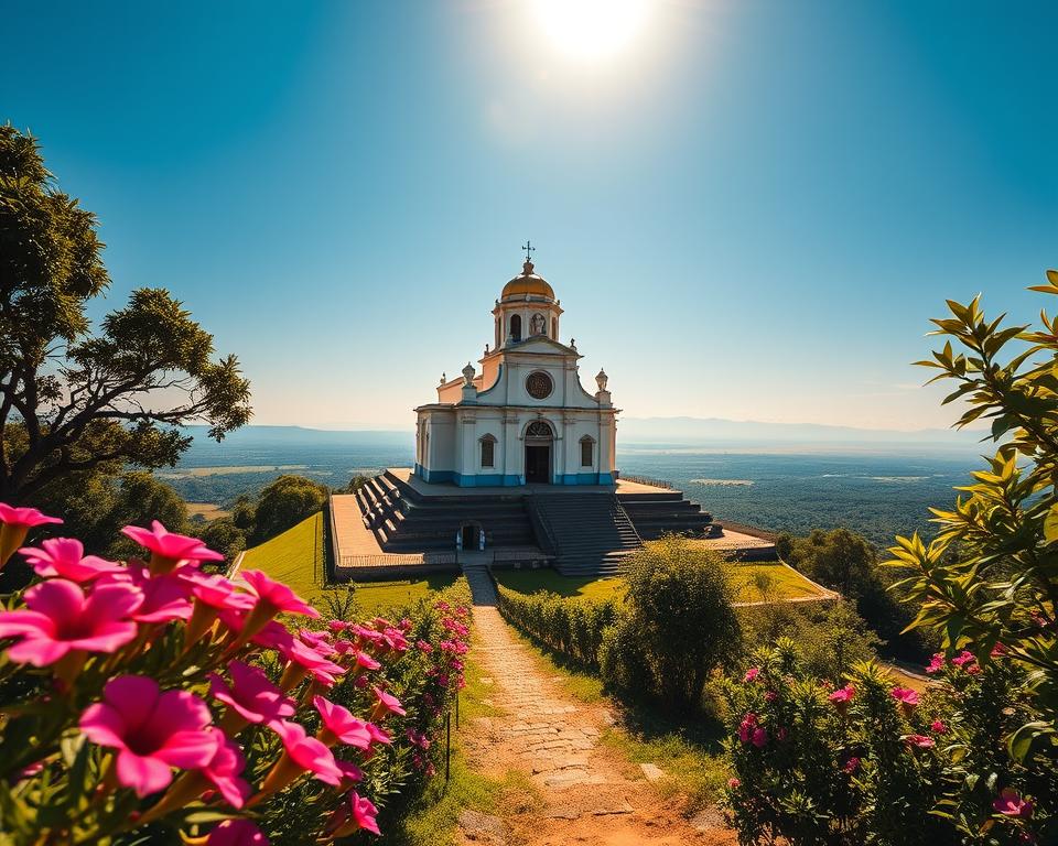 A stunning view of the church Nuestra Señora de los Remedios, perched gracefully atop the Cholula pyramid, surrounded by lush green landscapes. In the foreground, vibrant flowers in full bloom add color and life to the scene, while a well-maintained path leads up to the church's grand entrance. The middle ground features the striking white and gold facade of the church, with its iconic dome and intricate details under soft, golden sunlight. In the background, the expansive view of the valley and distant mountains stretches out beneath a clear blue sky, enhancing the majestic atmosphere. Capture this scene from a low angle to emphasize the height of the pyramid and church, conveying a sense of wonder and reverence. The overall mood is tranquil and awe-inspiring, inviting viewers to explore this historic landmark. A stunning view of the church Nuestra Señora de los Remedios, perched gracefully atop the Cholula pyramid, surrounded by lush green landscapes. In the foreground, vibrant flowers in full bloom add color and life to the scene, while a well-maintained path leads up to the church's grand entrance. The middle ground features the striking white and gold facade of the church, with its iconic dome and intricate details under soft, golden sunlight. In the background, the expansive view of the valley and distant mountains stretches out beneath a clear blue sky, enhancing the majestic atmosphere. Capture this scene from a low angle to emphasize the height of the pyramid and church, conveying a sense of wonder and reverence. The overall mood is tranquil and awe-inspiring, inviting viewers to explore this historic landmark.